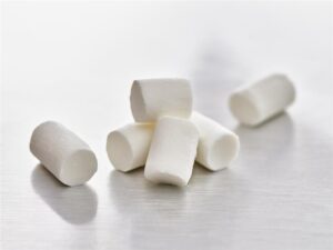 Photo présentant plusieurs mini bûchettes de chèvre IQF pour les industriels de l'agroalimentaire